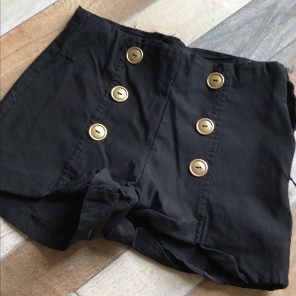 Black shorts with gold button detail